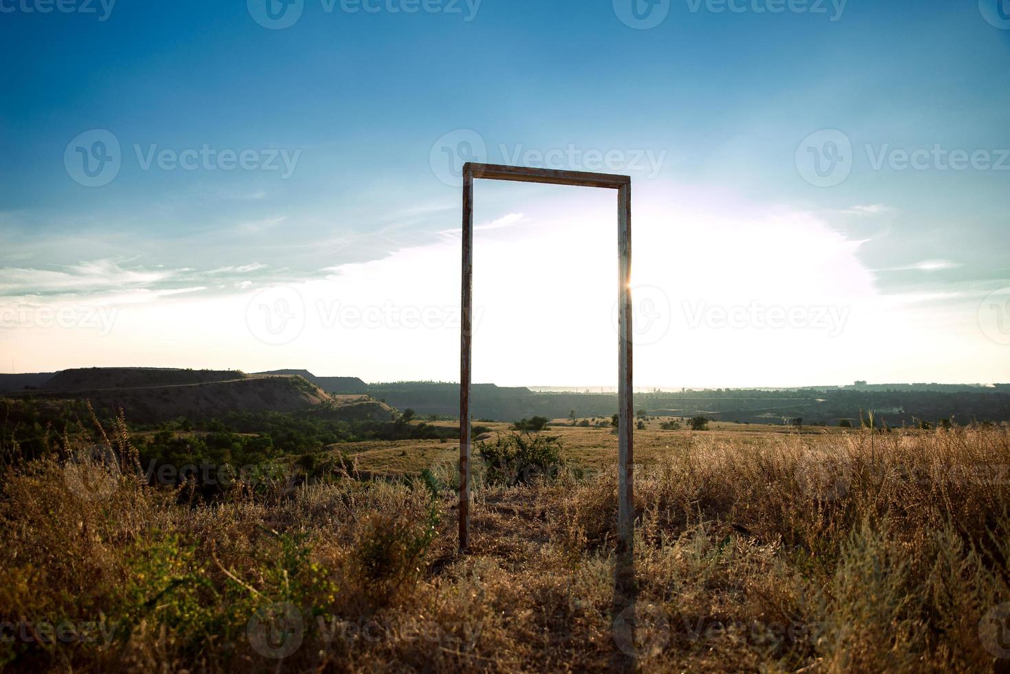 Autumnmal concept with a bunch , autumn leaves and an old wooden frame door photo