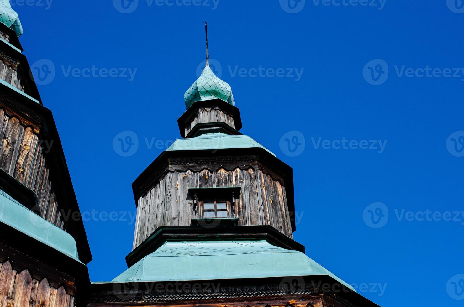 Ancient wooden church  in Ukraine Cross photo
