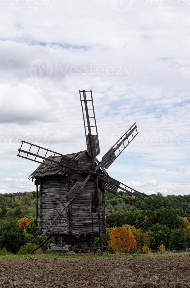 Summer landscape with an old wooden mill photo