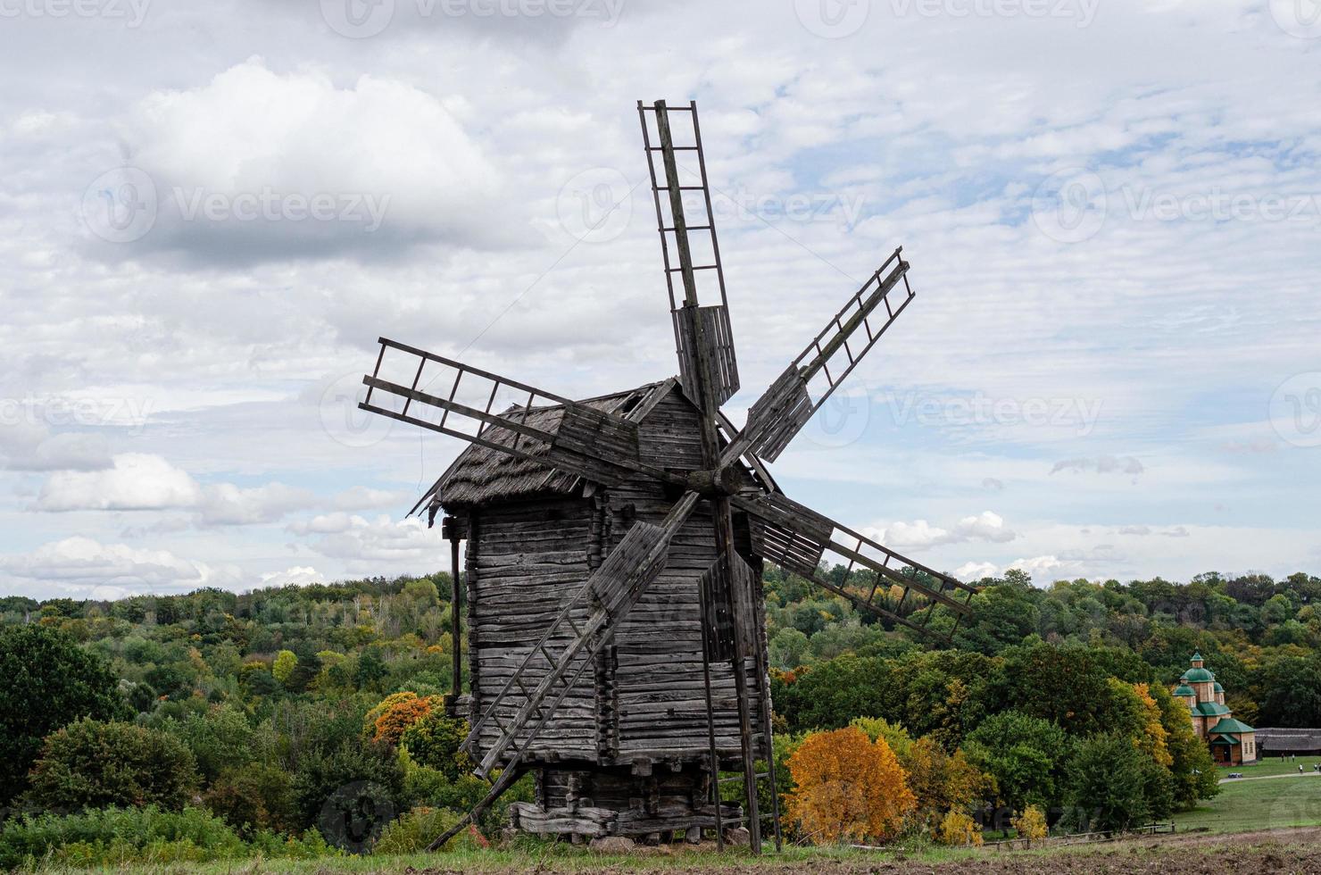 Summer landscape with an old wooden mill photo