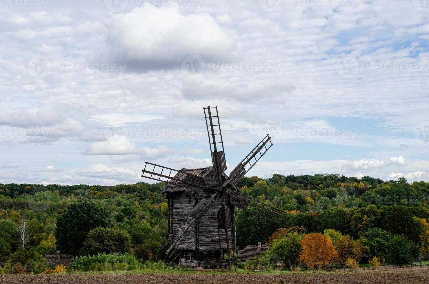 Summer landscape with an old wooden mill photo