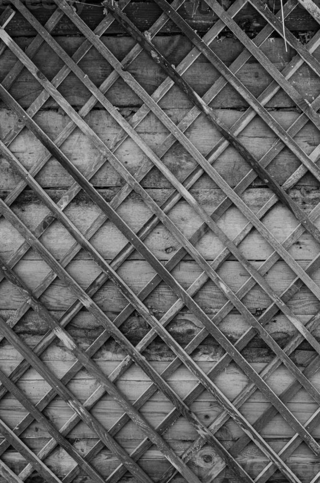 fence made of tree branches boards photo