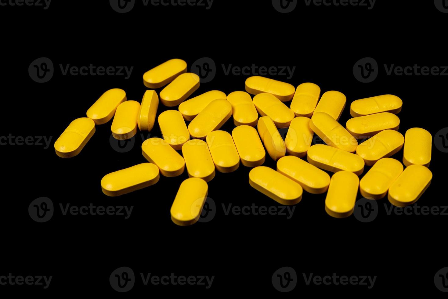 Medical orange pills on isolated on black background 13749013 Stock