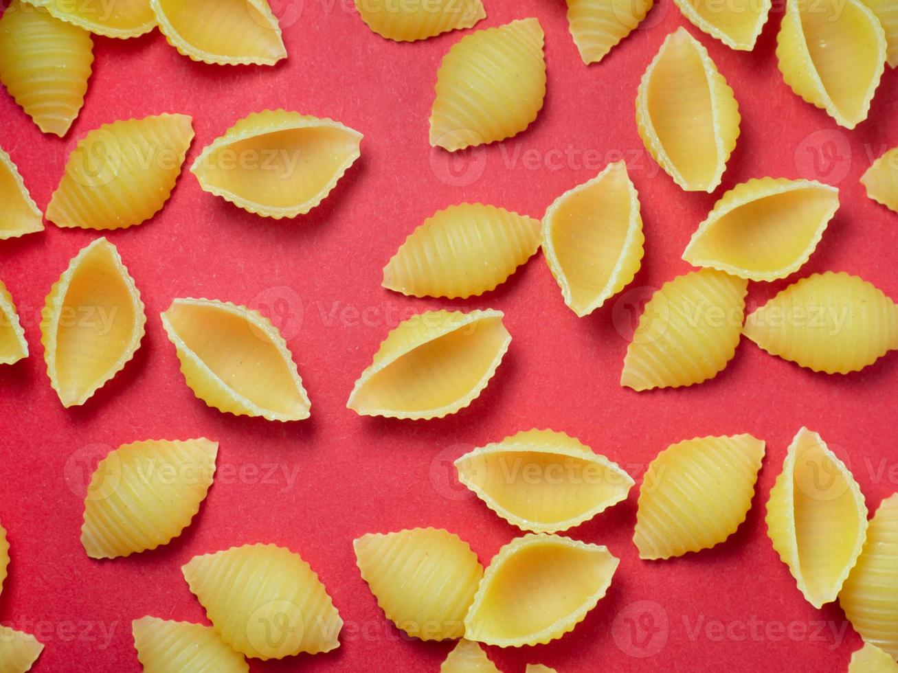 Shell-shaped pasta on the table. Background. Italian food. Cuisine of the peoples of the world. Cooking food. photo