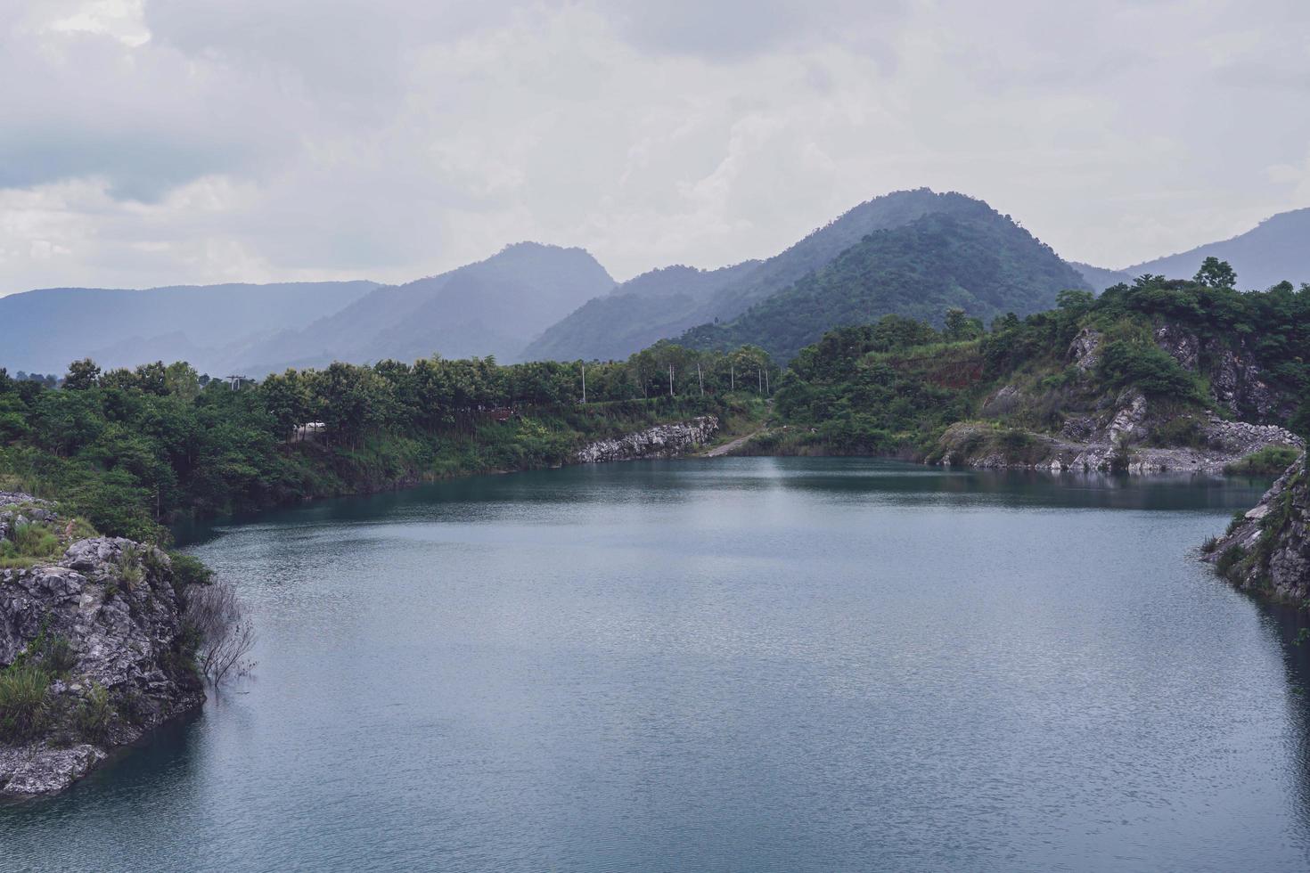 The limestone mountains after the concession explosion during the rainy season form a large and beautiful pond. photo