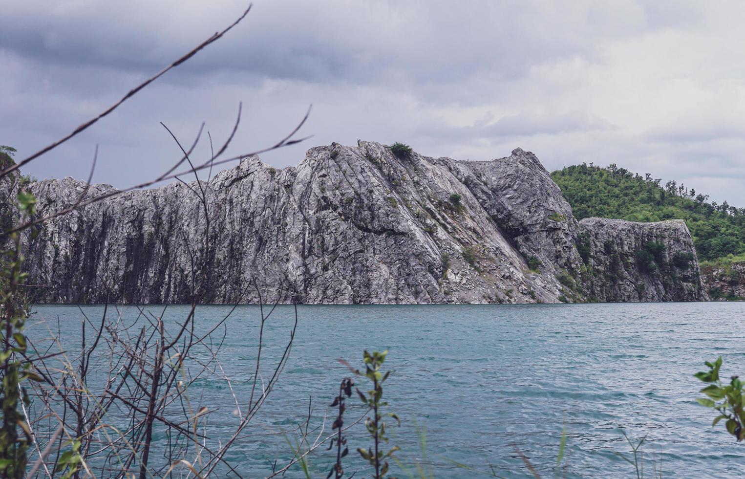 The limestone mountains after the concession explosion during the rainy season form a large and beautiful pond. photo