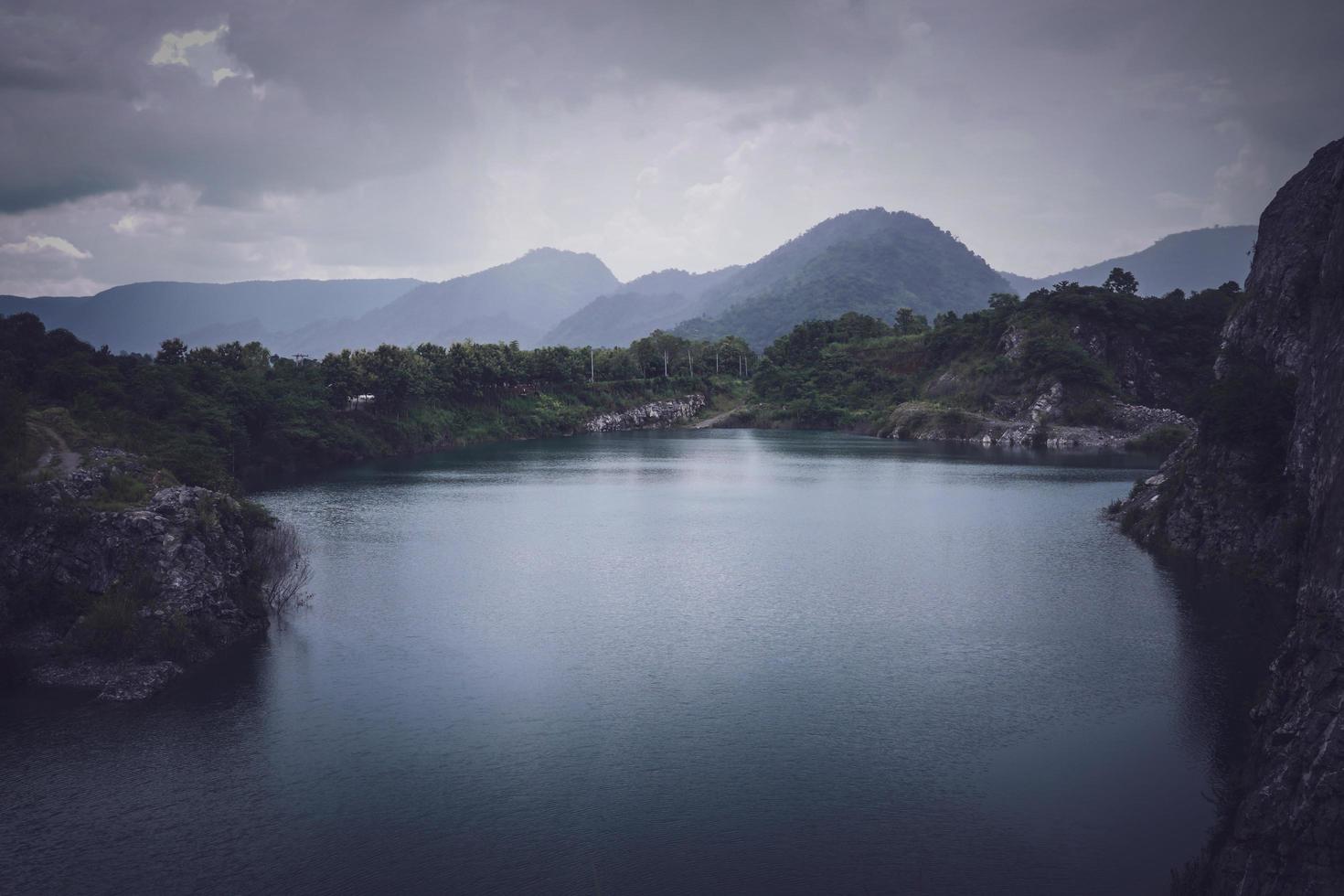 The limestone mountains after the concession explosion during the rainy season form a large and beautiful pond. photo