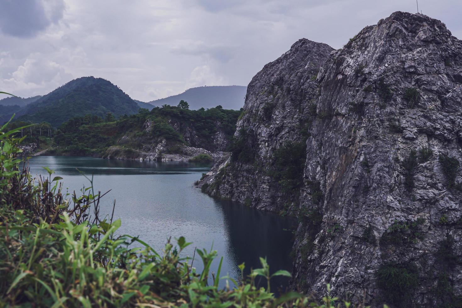 The limestone mountains after the concession explosion during the rainy season form a large and beautiful pond. photo