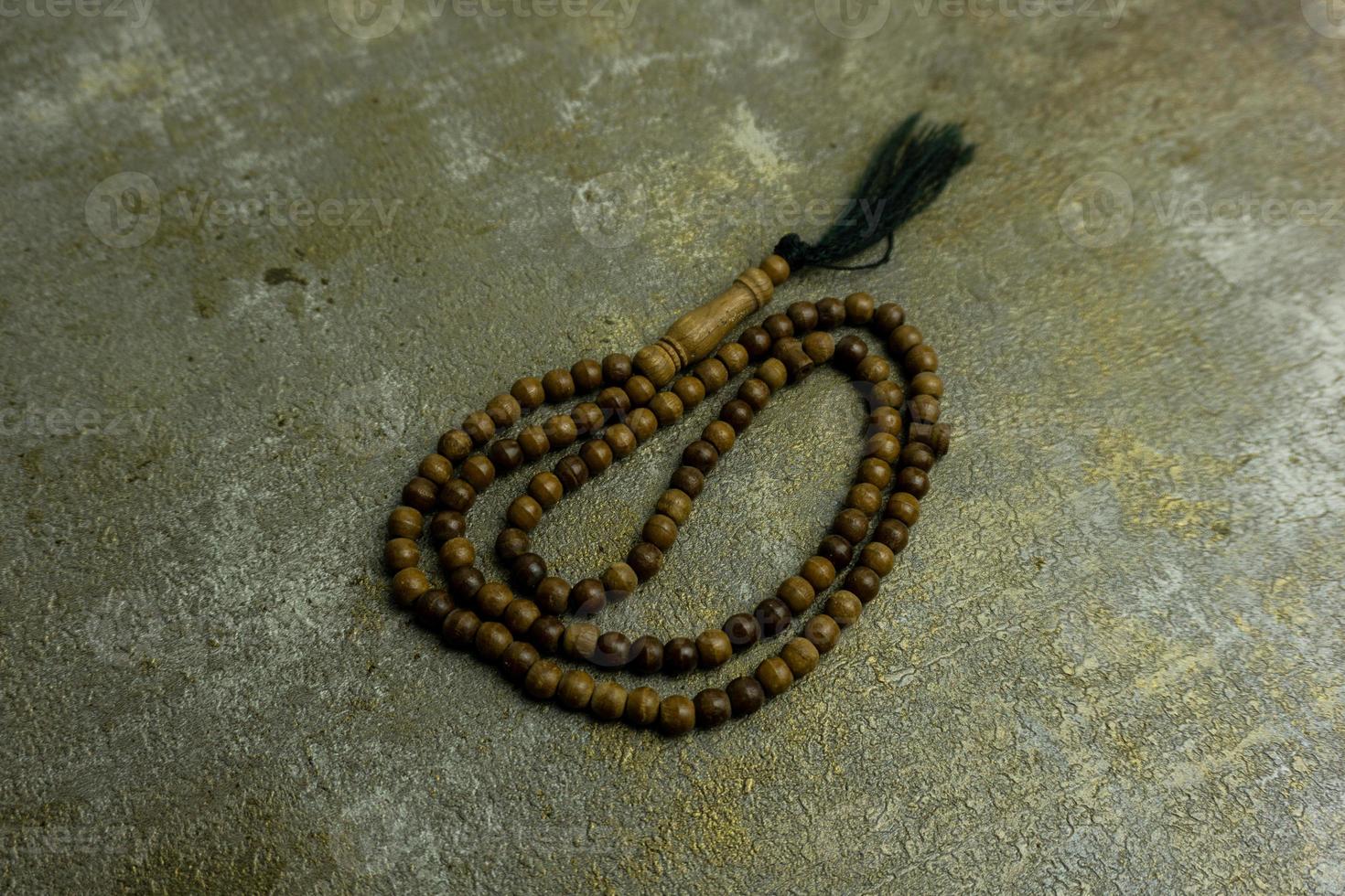 wooden tasbih beads isolated. islamic prayer beads photo