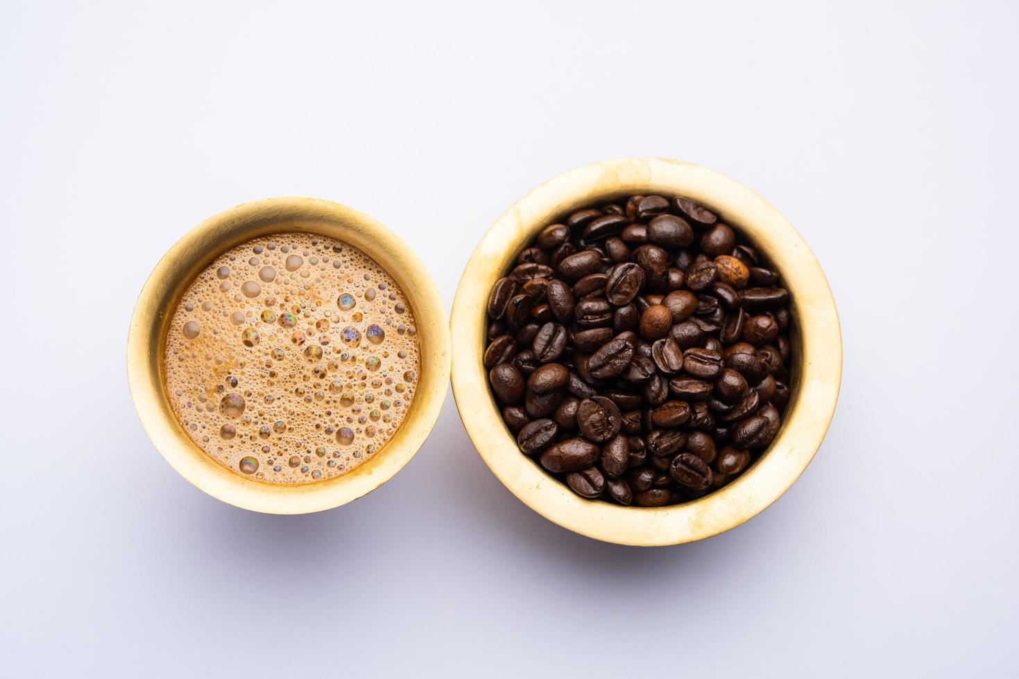 South Indian Filter coffee served in a traditional brass or stainless steel cup photo