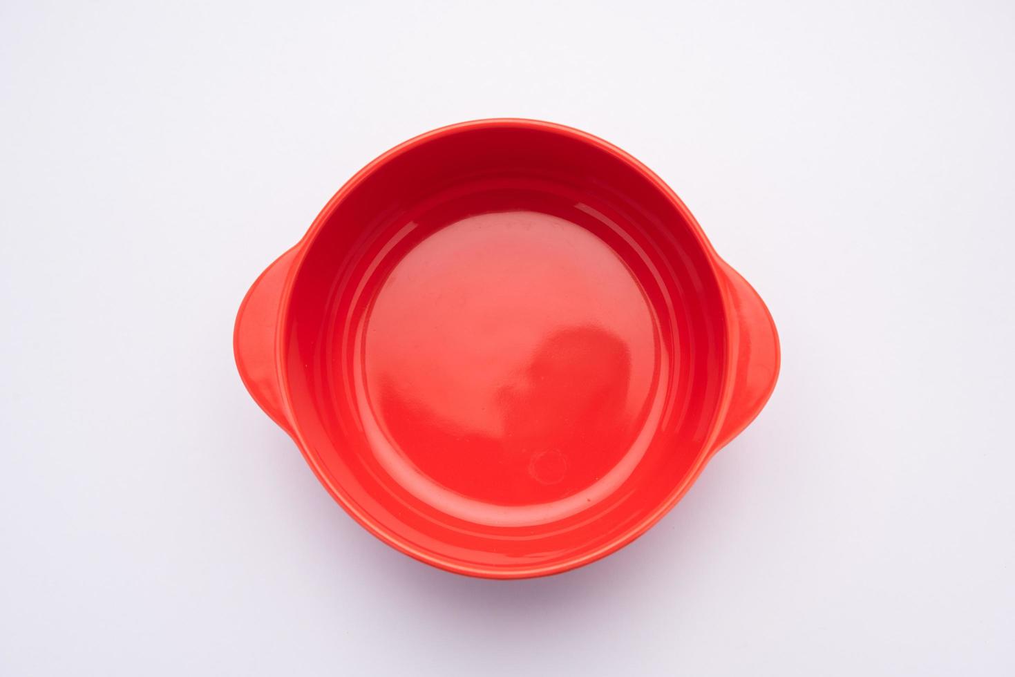 Empty Red ceramic bowl or container photo