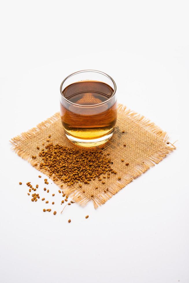 Fenugreek Seeds or Methi Dana drink by soaking it in water overnight. Indian Health tonic photo