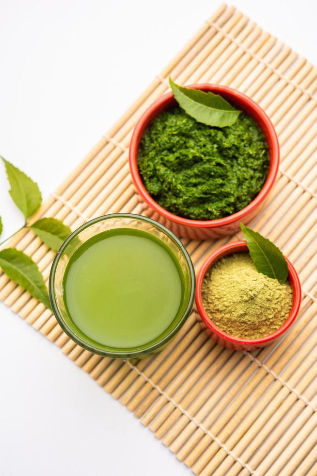 Neem Powder, paste and juice. Azadirachta indica or commonly known as nimtree or Indian lilac photo