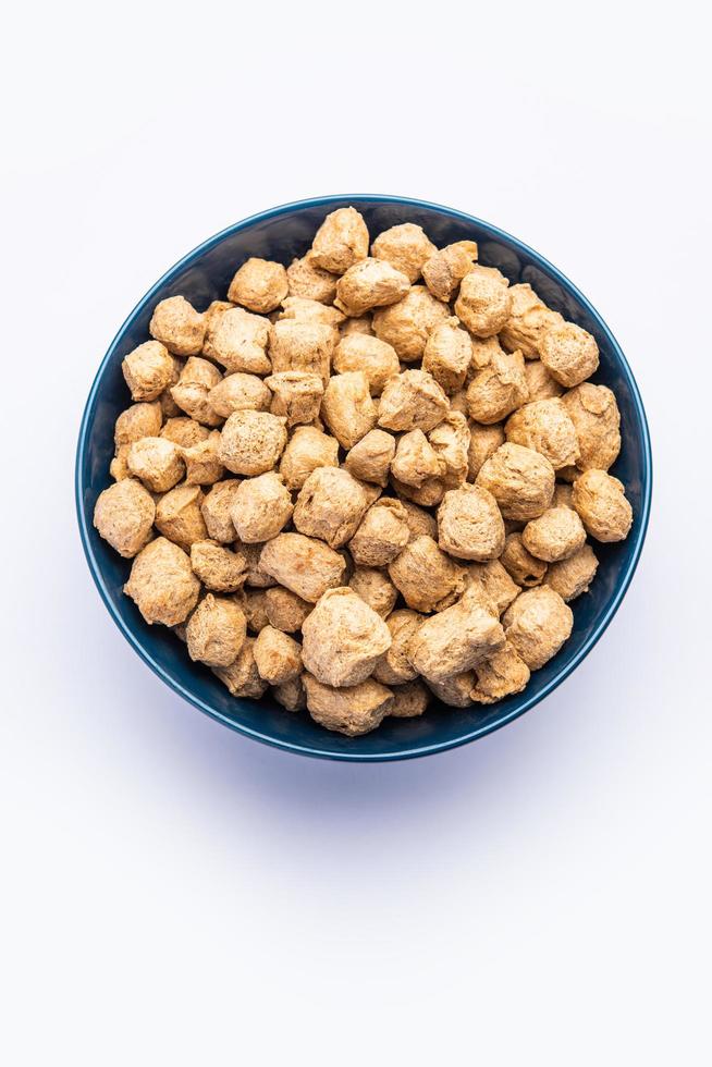 Glycine max or Soya bean or uncooked soybean chunks. Served in a bowl or as a Pile. selective focus photo