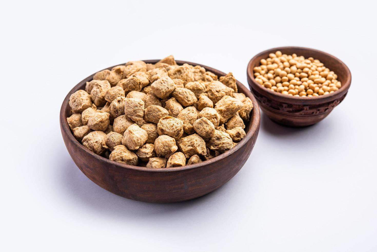 Glycine max or Soya bean or uncooked soybean chunks. Served in a bowl or as a Pile. selective focus photo