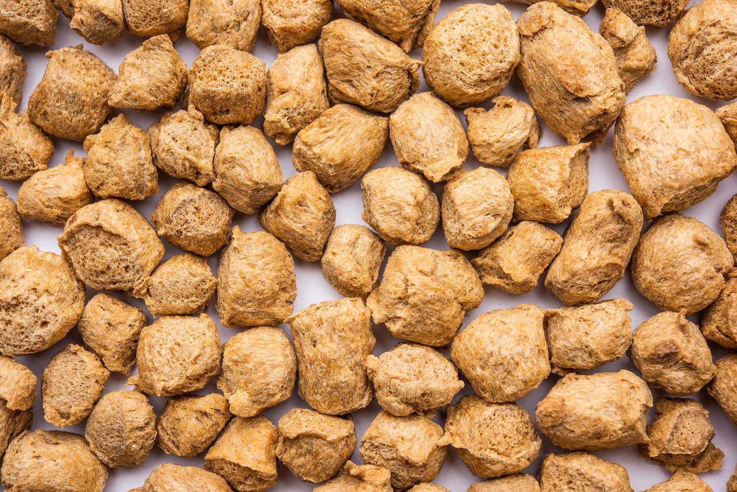 Glycine max or Soya bean or uncooked soybean chunks. Served in a bowl or as a Pile. selective focus photo