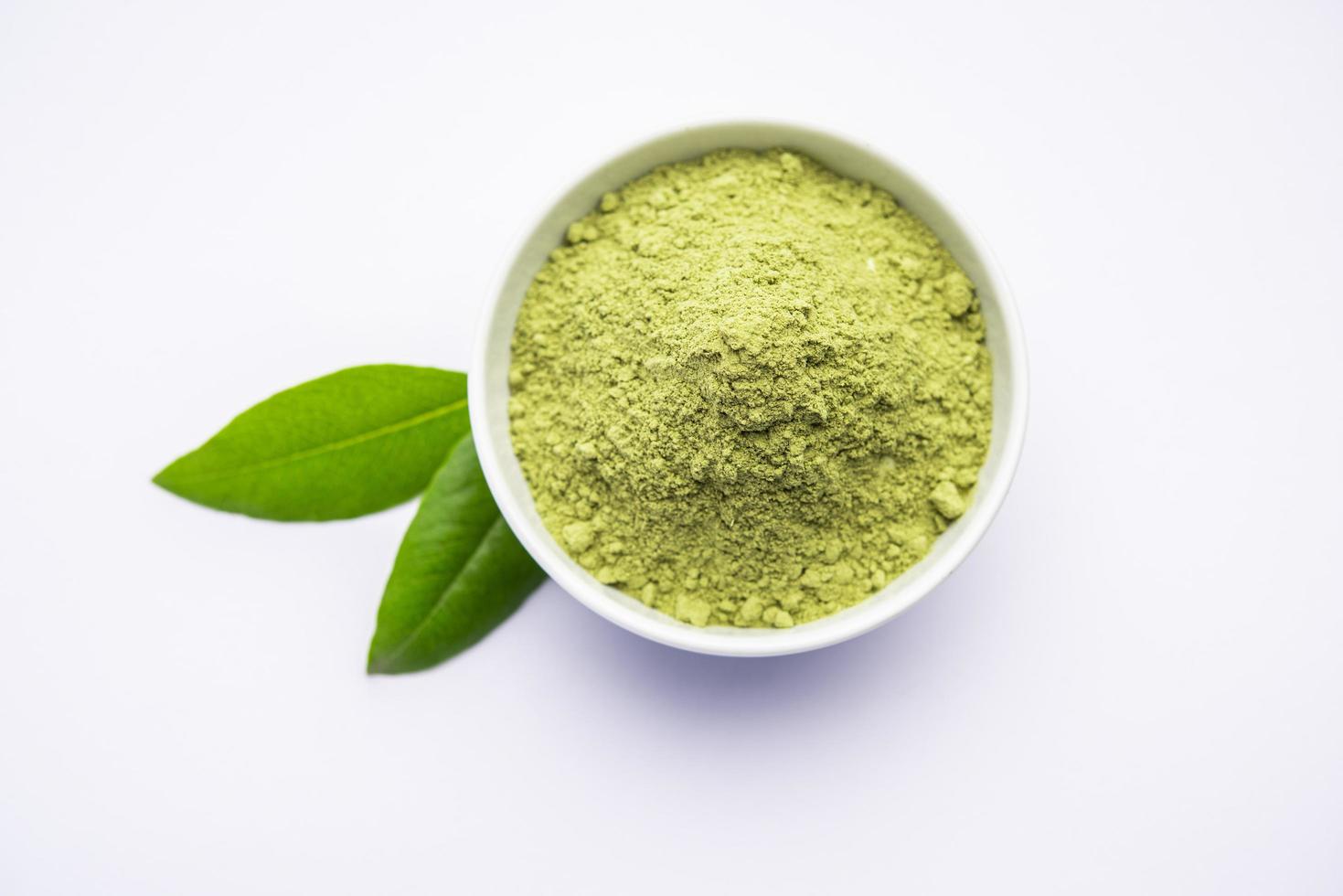 Herbal henna or Mehandi powder in a bowl forming heap, Used for Tattoo or Hair Dye in India photo