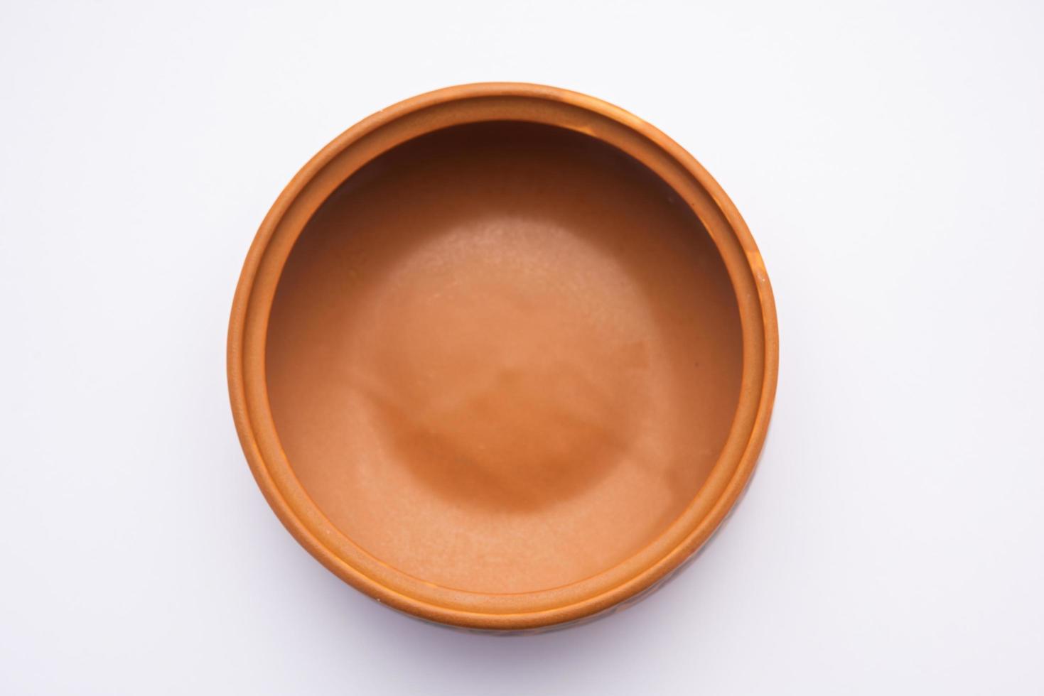 Empty Terracotta bowl or earthen serving crockery photo