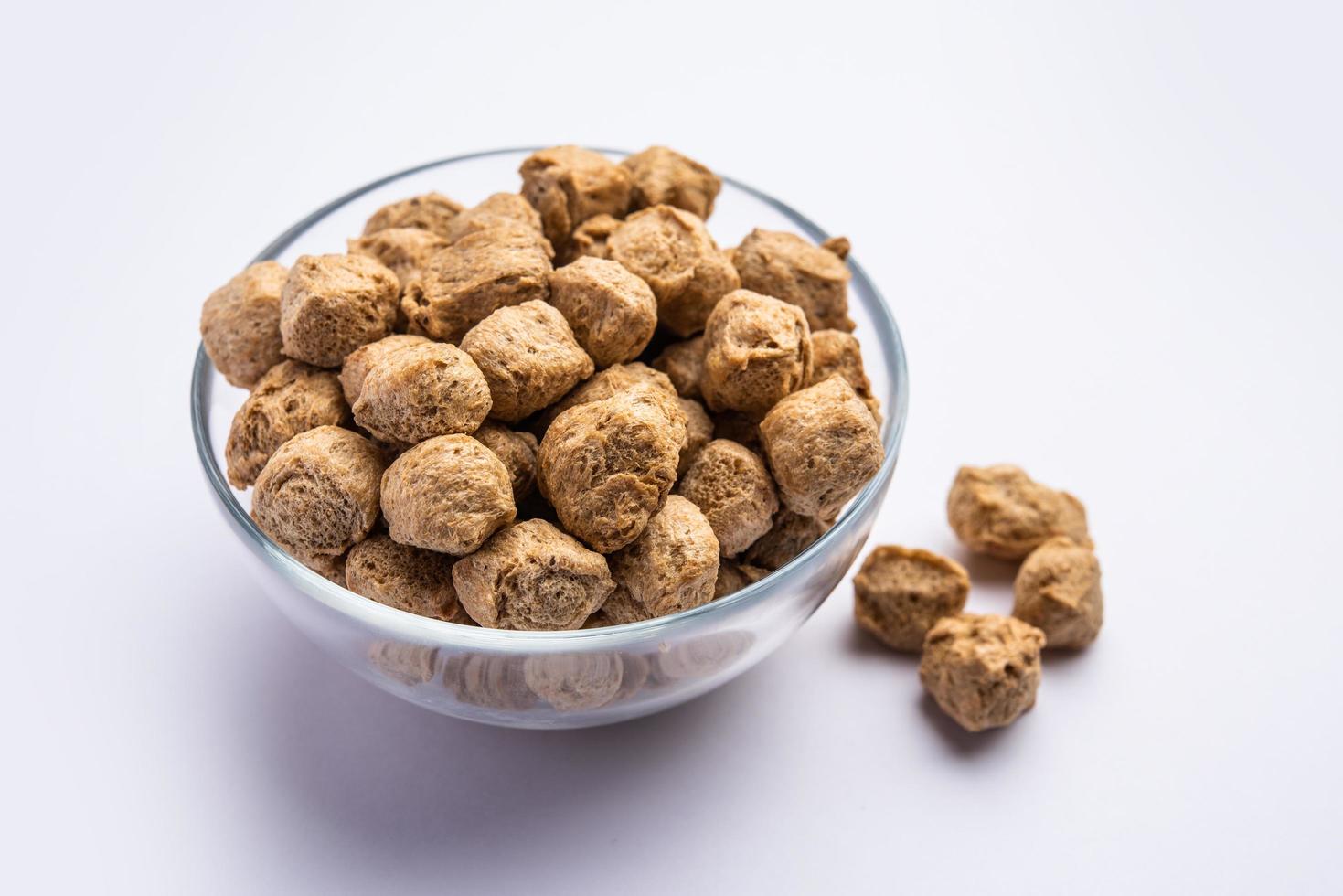 Glycine max or Soya bean or uncooked soybean chunks. Served in a bowl or as a Pile. selective focus photo