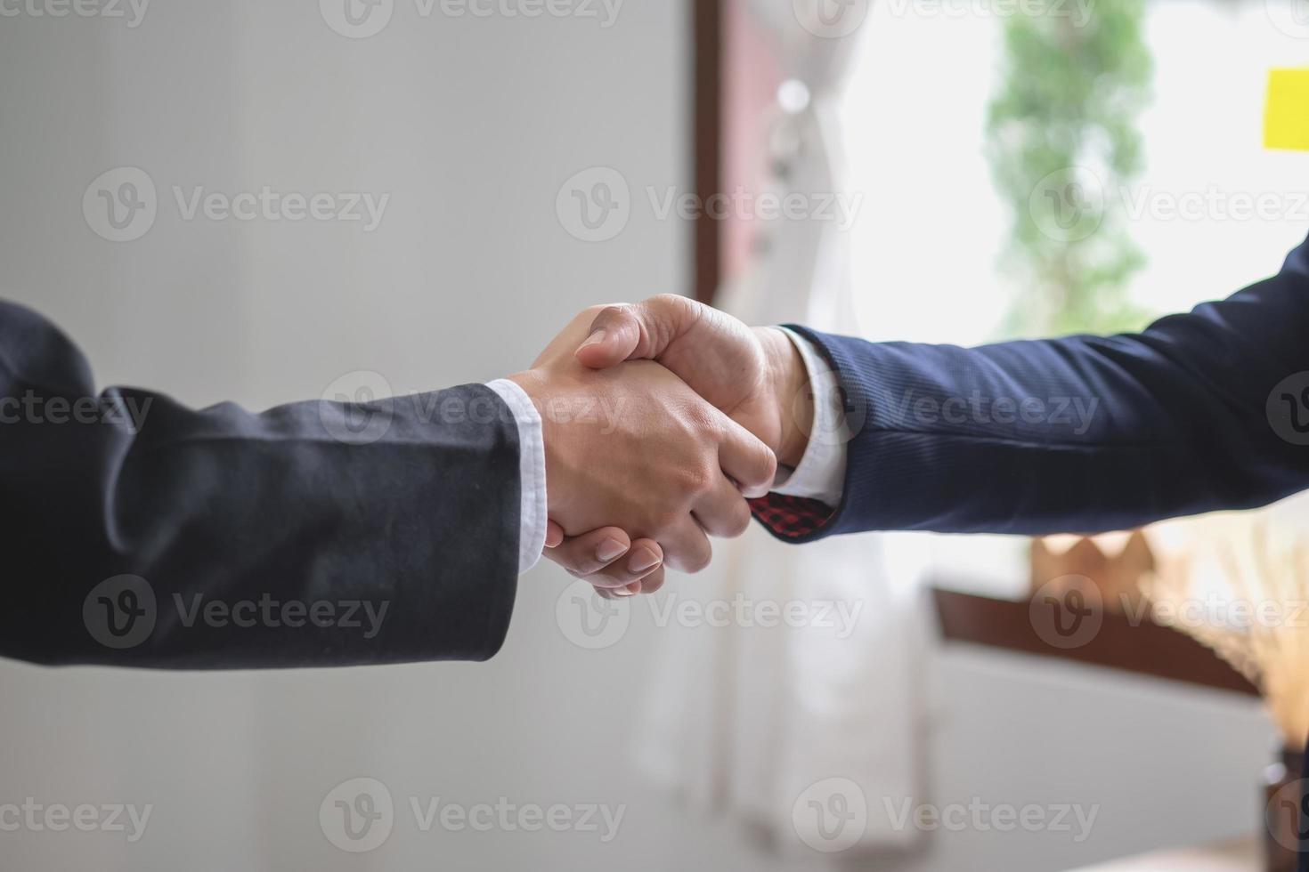 two business men shake hands for business cooperation photo