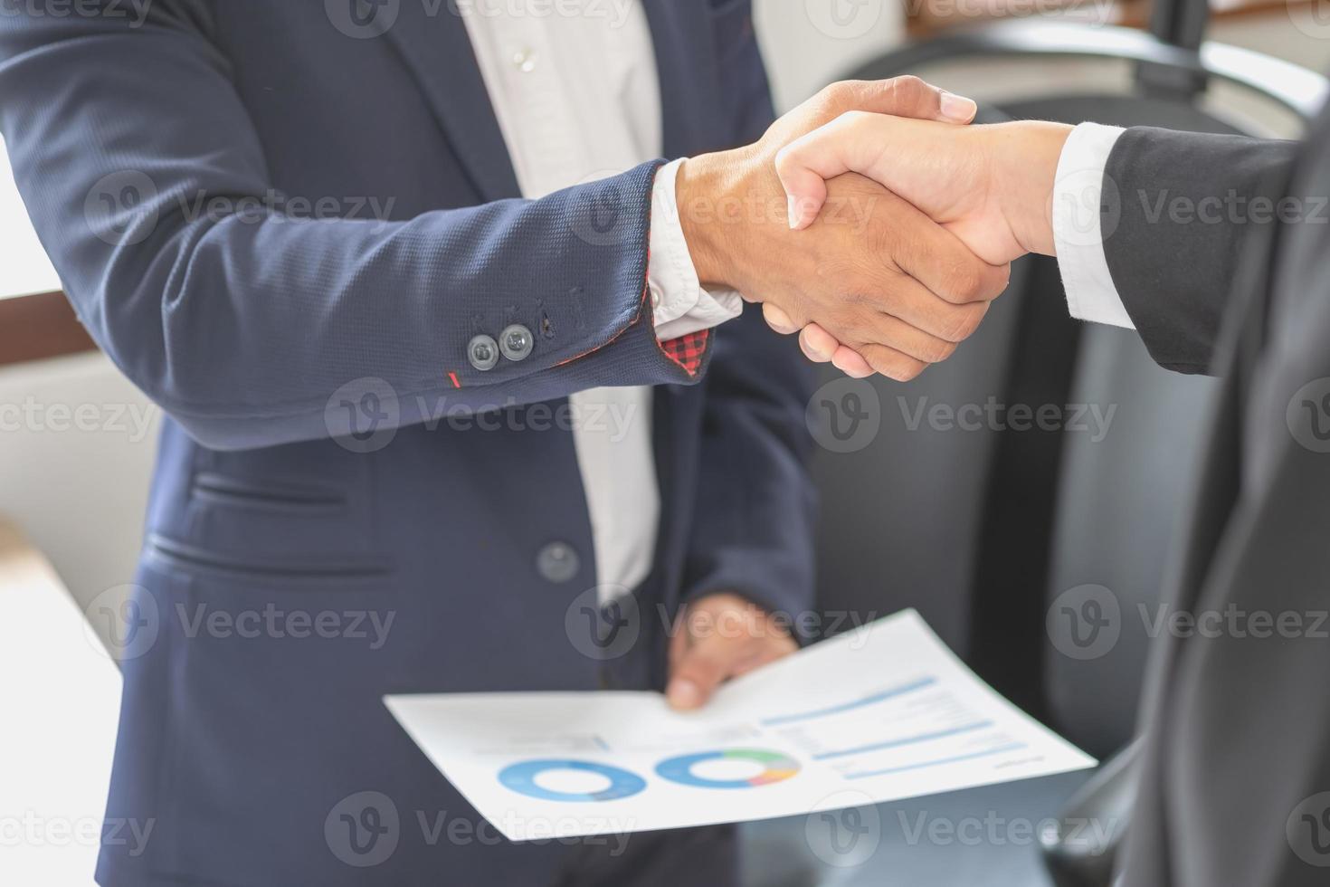 two business men shake hands for business cooperation photo