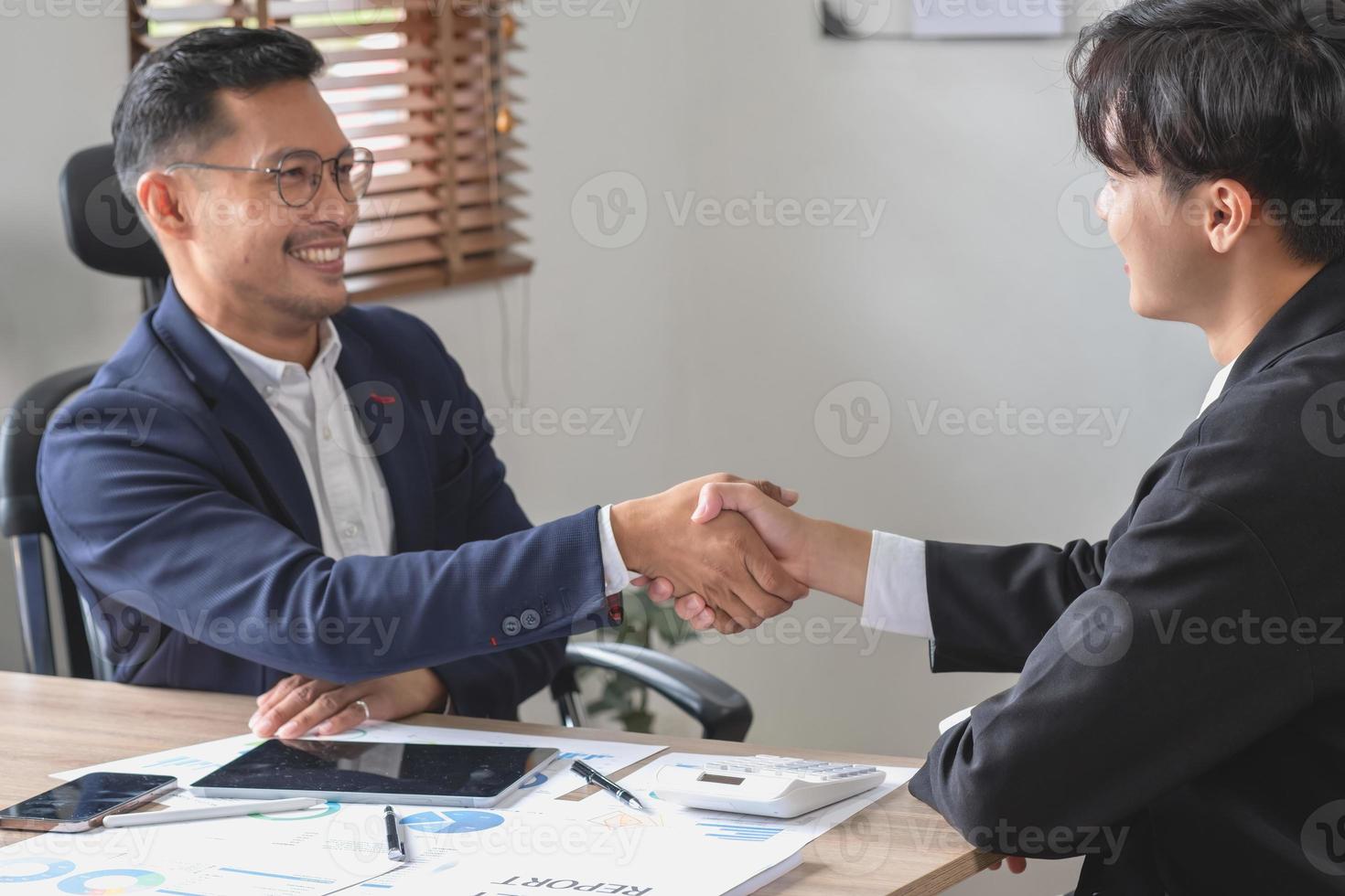 two business men shake hands for business cooperation photo