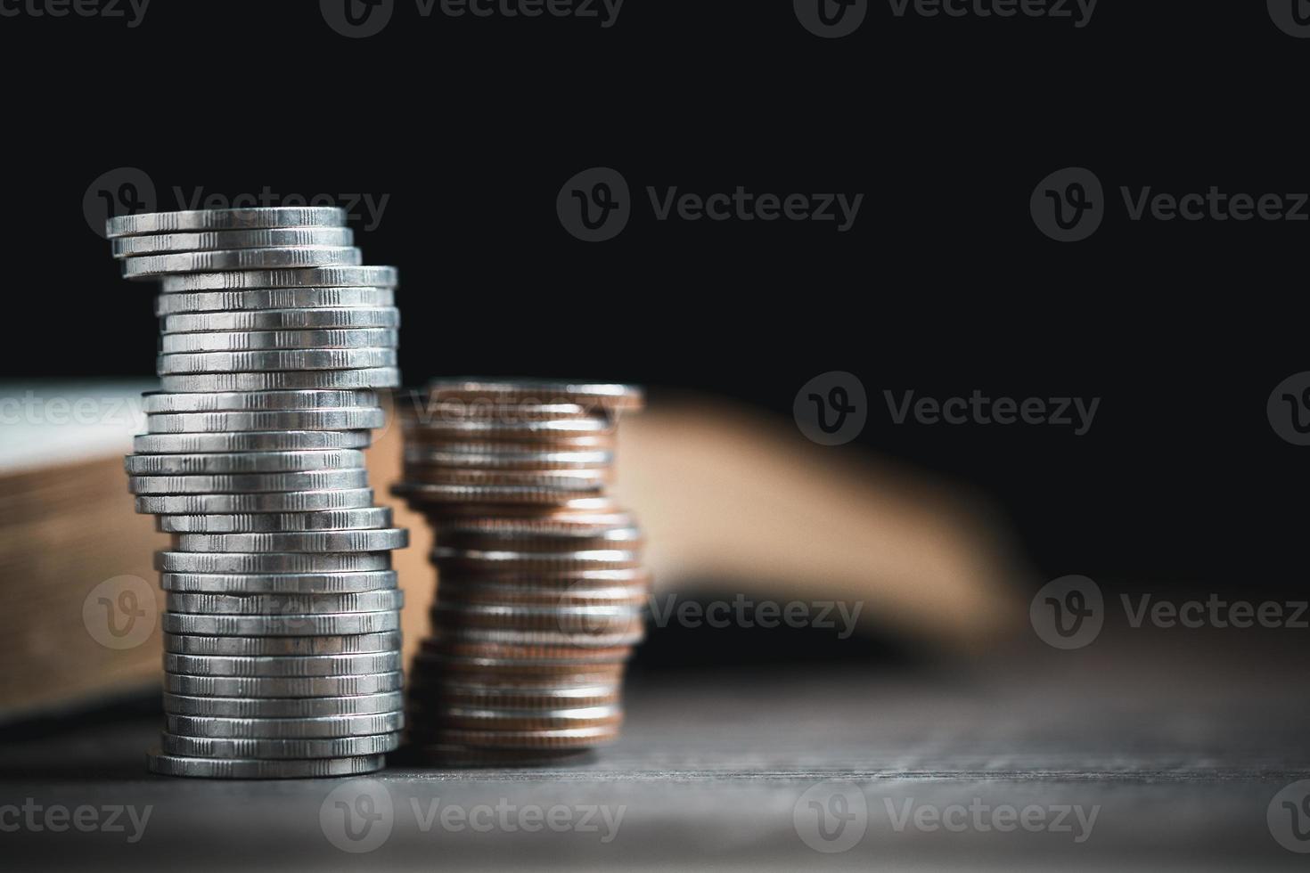 One tenth or tithe is basis on which Bible teaches us to give one tenth of first fruit to God. coins with Holy Bible. Biblical concept of Christian offering, generosity, and giving tithes in church. photo