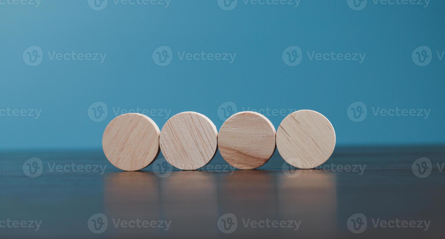 Stacking blank wooden cubes on blue background with copy space for input wording and infographic icon. Empty brown wooden object block for symbol icon put technology, zero gravity, business concept. photo