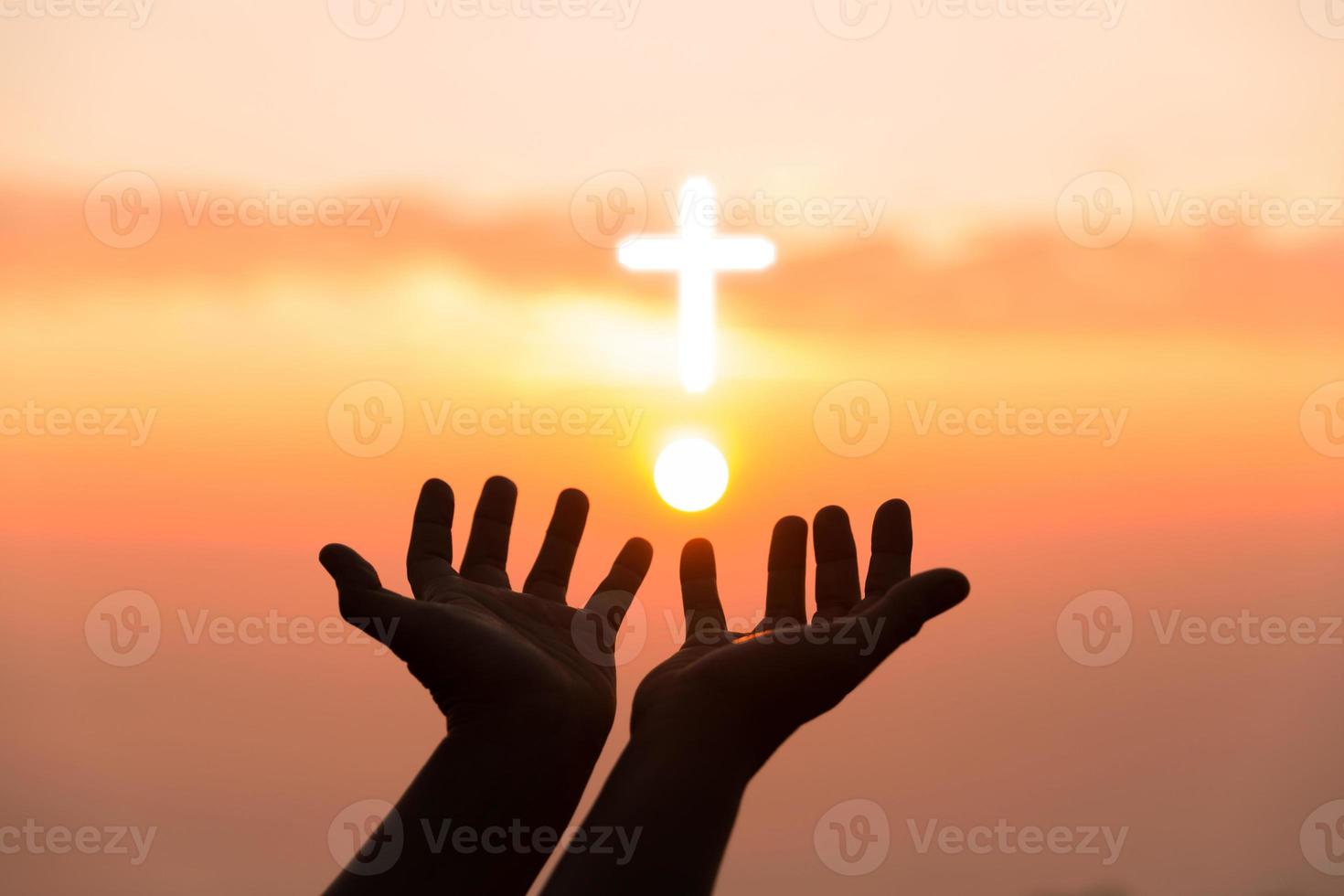 Silhouette of woman hand praying spirituality and religion, female worship to god. Christianity religion concept. Religious people are humble to God. Christians have hope faith and faith in god. photo