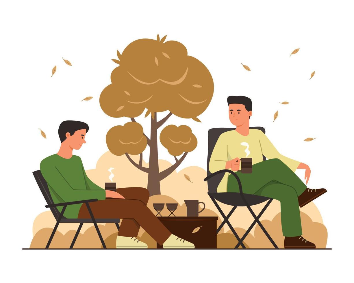 un par de hombres hacen un picnic en el parque y disfrutan de la vida al aire libre en la temporada de otoño vector