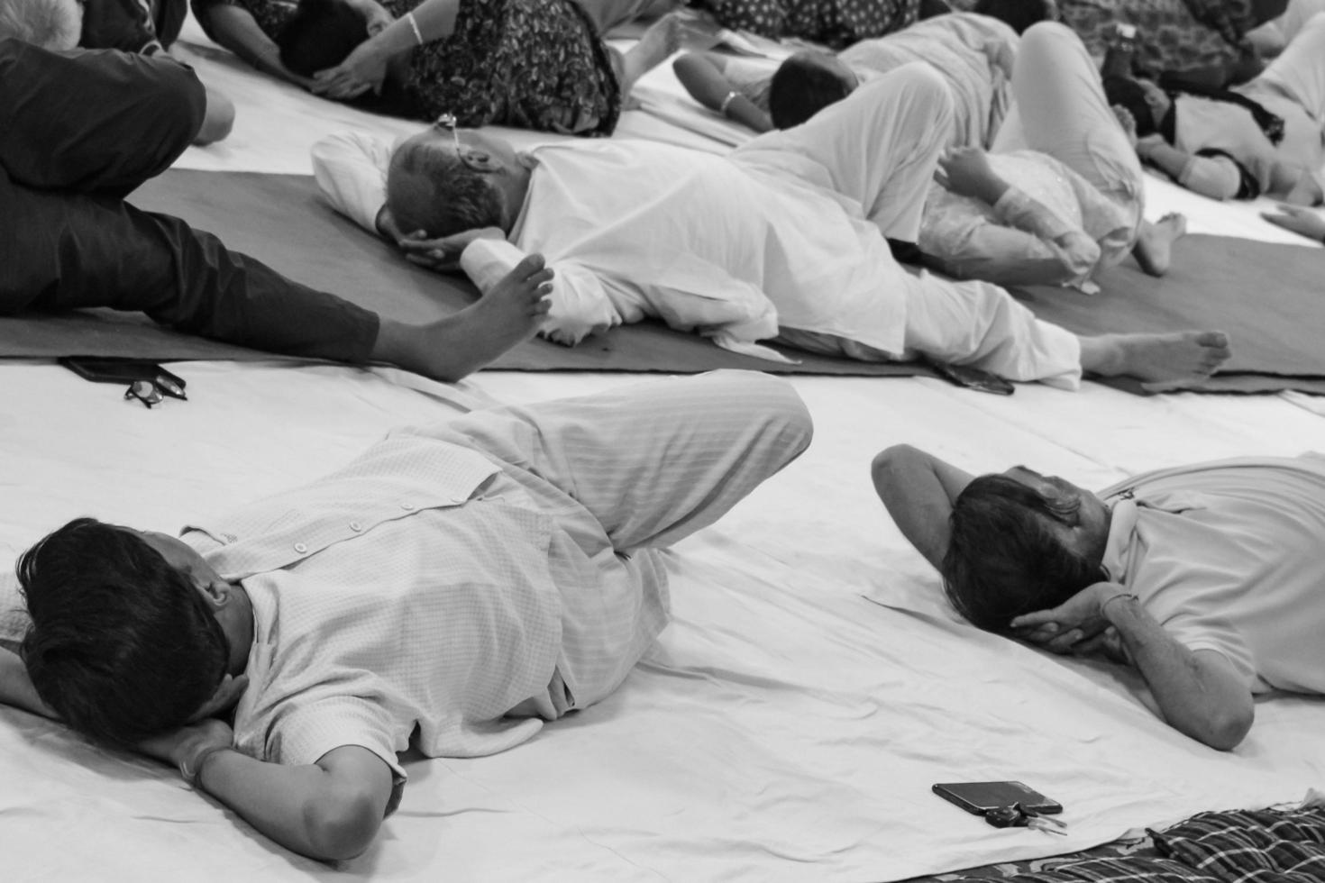 Delhi, India, June 19 2022-Group Yoga exercise session for people of different age groups in Balaji Temple,Vivek Vihar, International Yoga Day, Big group of adults attending yoga class-Black and White photo