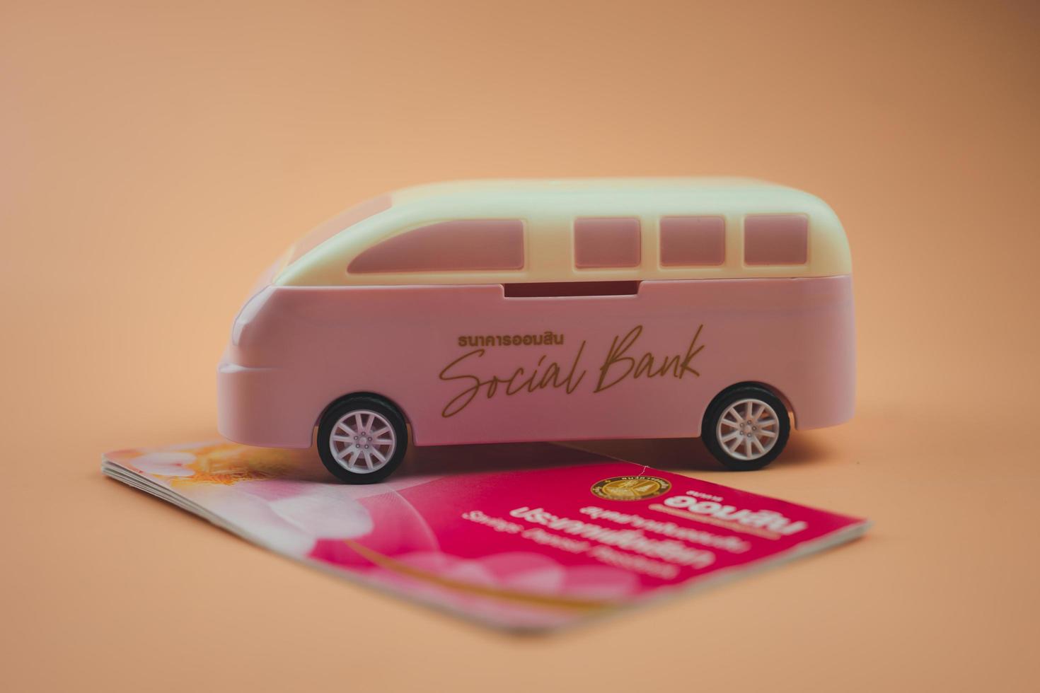 Bangkok, Thailand - October 31, 2022 The Government Savings Bank handing out car shaped piggy bank when your deposit money on National Savings Day 2022. photo