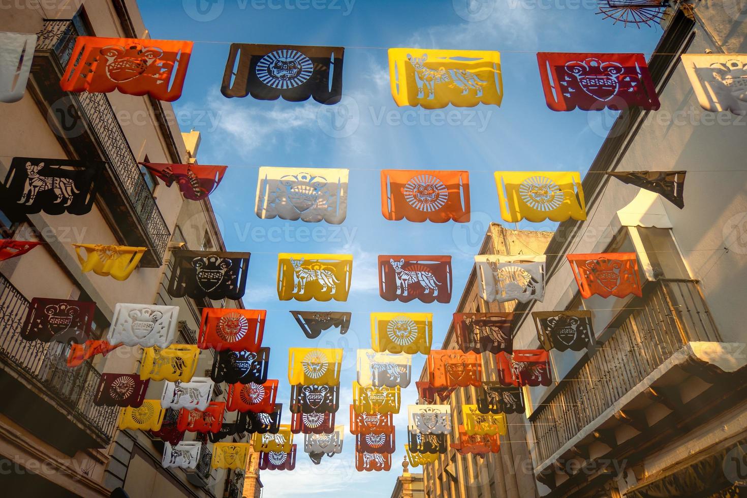 Mexico street with decorations made of paper on day of the dead photo