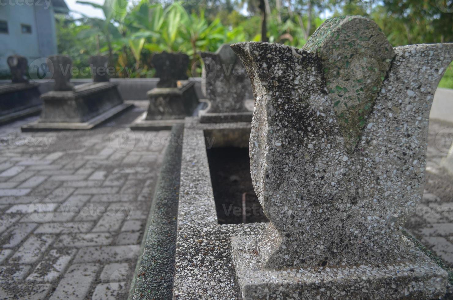 Soft focus A typical tomb grave in Java. Family funeral in Java, Indonesia. Creepy. Halloween concept photo