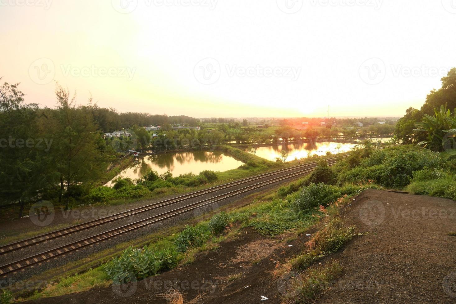 Railroad tracks in the fall. Empty railroad tracks, open landscape. Perspective view photo