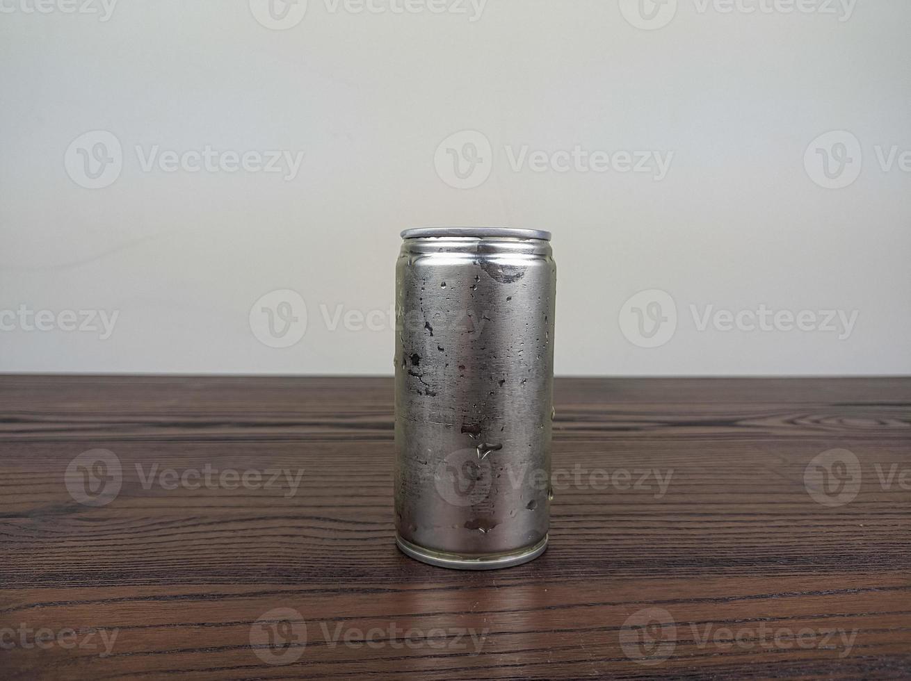 close up cans of cold energy drinks on a wooden table photo