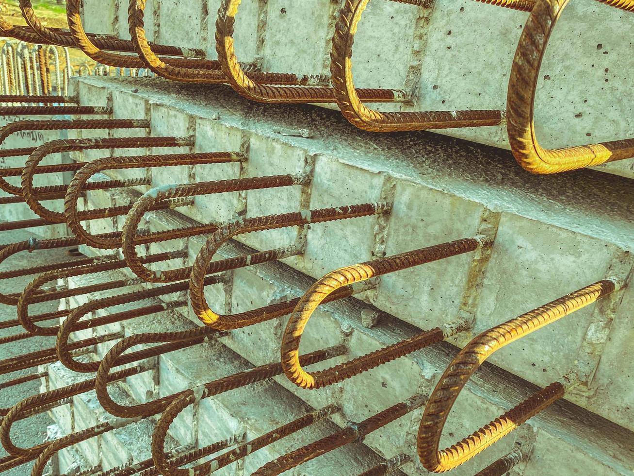 texture, background. concrete block with rusty rebar sticking out inside. fasteners for the construction of concrete high houses. building material photo