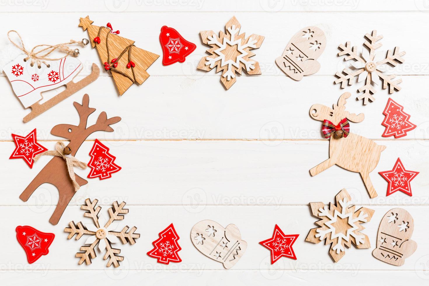 Top view of Christmas decorations and toys on wooden background. Copy space. Empty place for your design. New Year concept photo