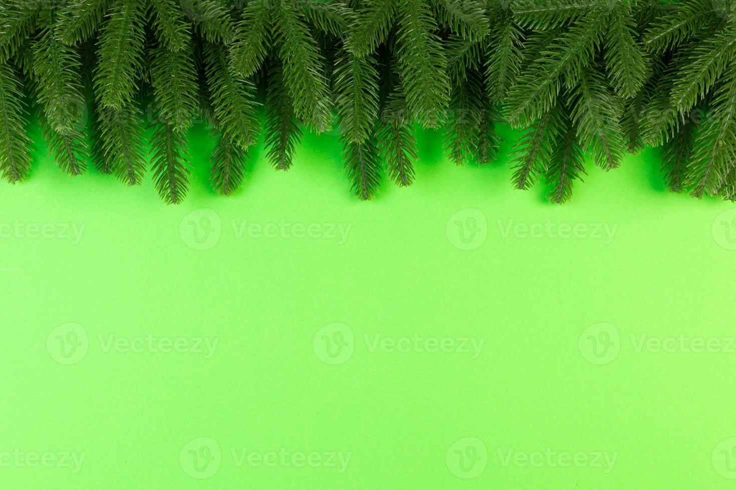 Top view of colorful festive background made of fir tree branch. Christmas holiday concept with copy space photo