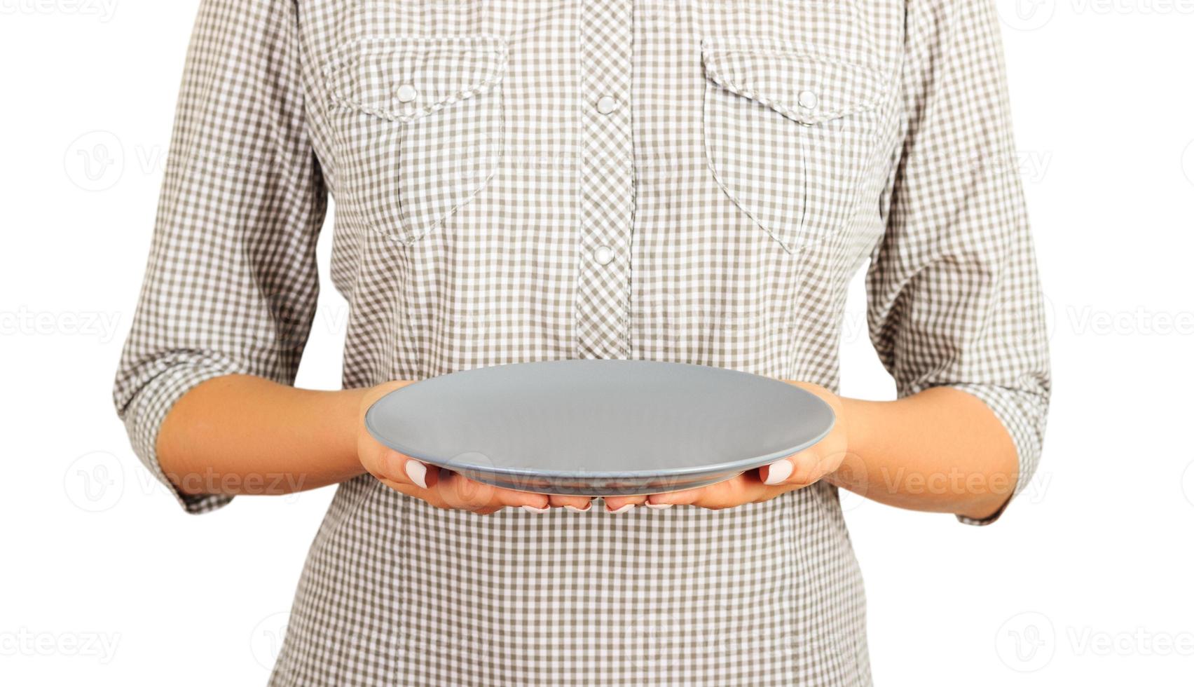 girl is holding an empty gray matte plate. Isolated on white background Template for your design. perspective view photo