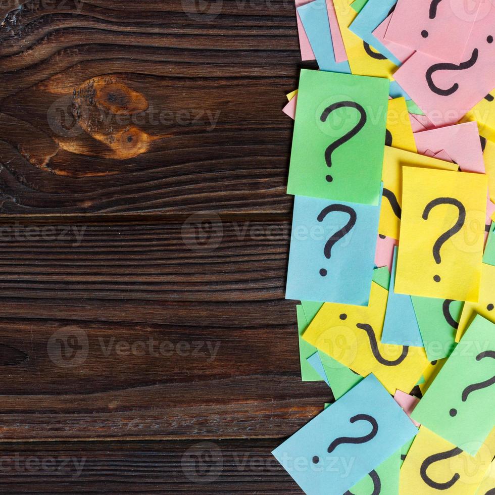 colorful question marks background written reminders tickets. ask or business concept with copy space photo