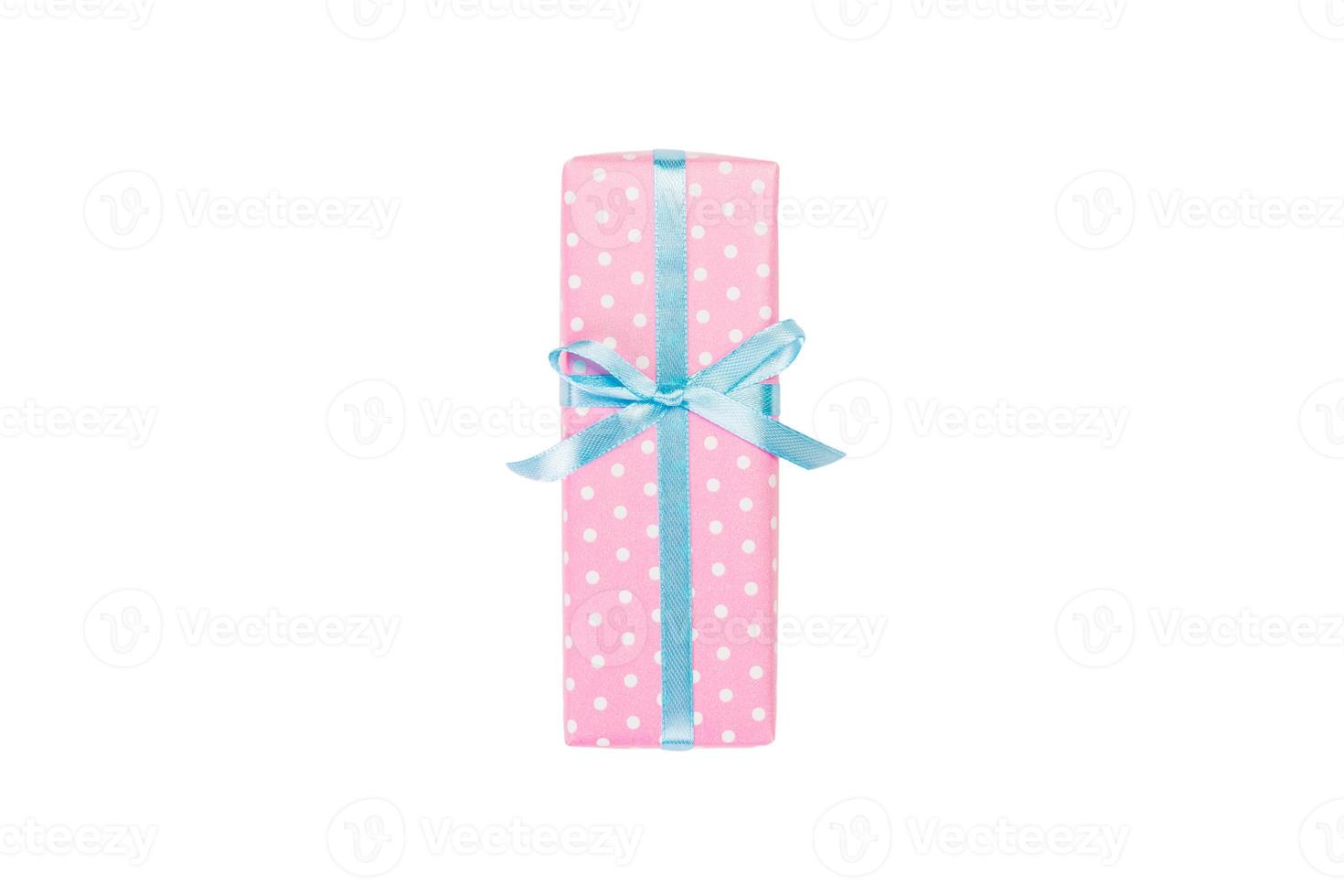 Christmas or other holiday handmade present in pink paper with blue ribbon. Isolated on white background, top view. thanksgiving Gift box concept photo