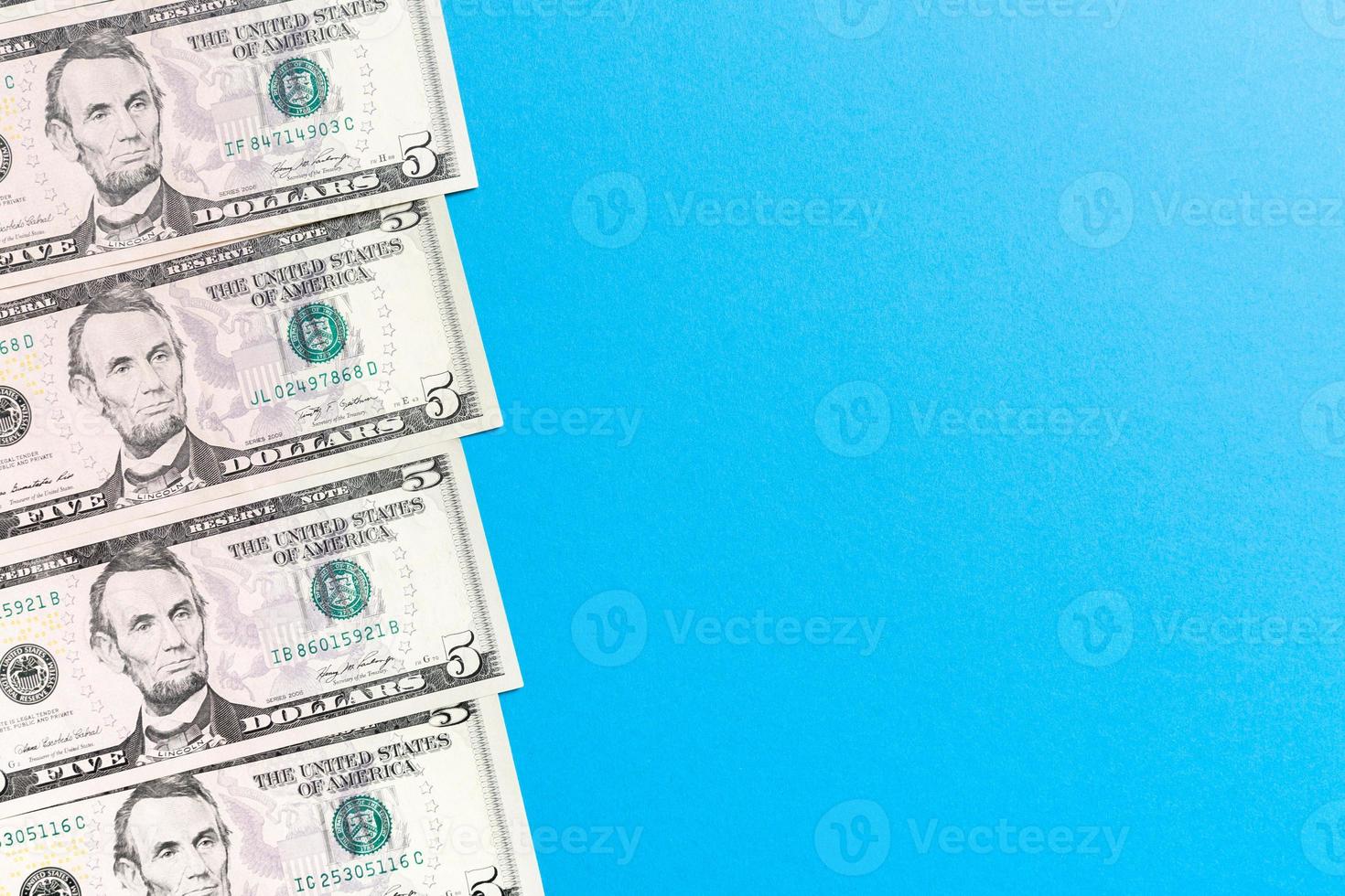 five dollar bills Top view of business concept on background with copy space photo