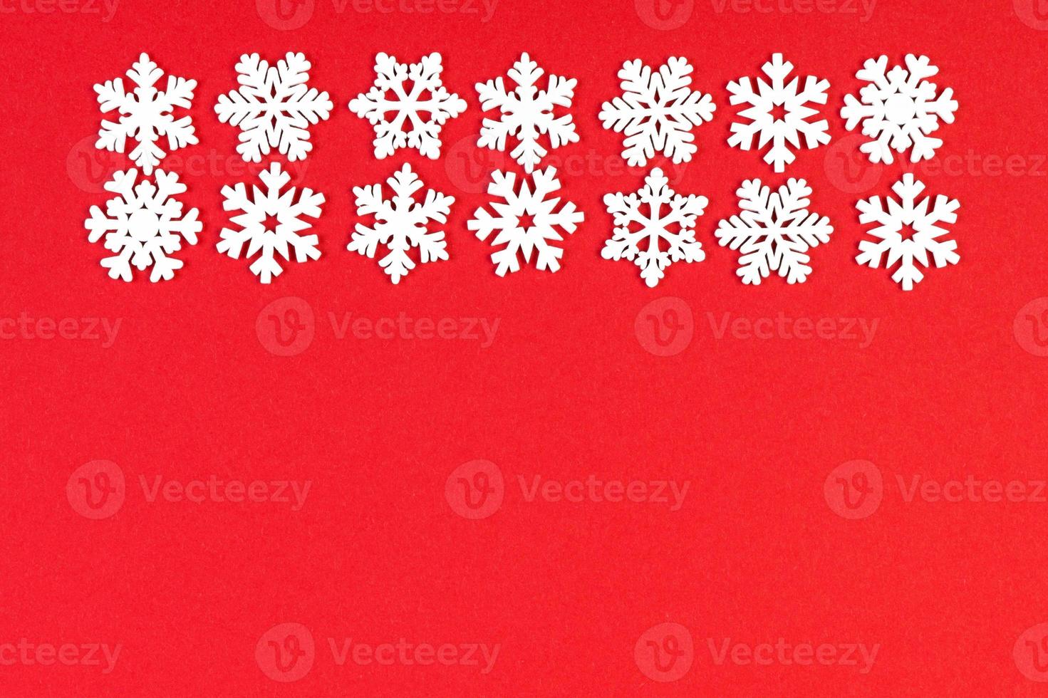 Top view of winter ornament made of white snowflakes on colorful background. Happy New Year concept with copy space photo