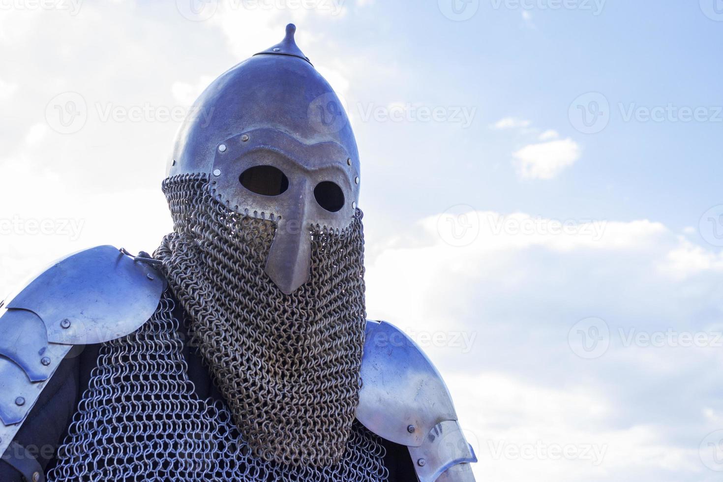 Modern copy of antique metal knight helmet with aventail. Historical medieval costume detail photo