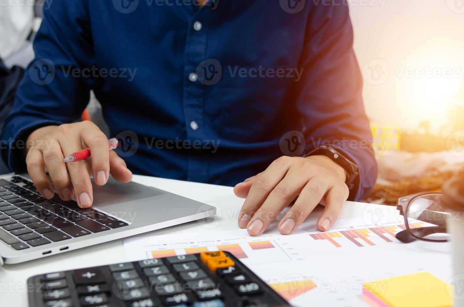 Businessman analyzing investment graph and charts with laptop. Financial Accounting and marketing business concept. photo