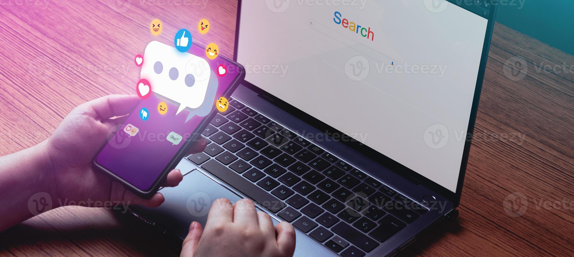 Young woman hand using smartphone chatting with chat box icons pop up. Banner of smartphone with an hologram conversation. Social media marketing concept. photo