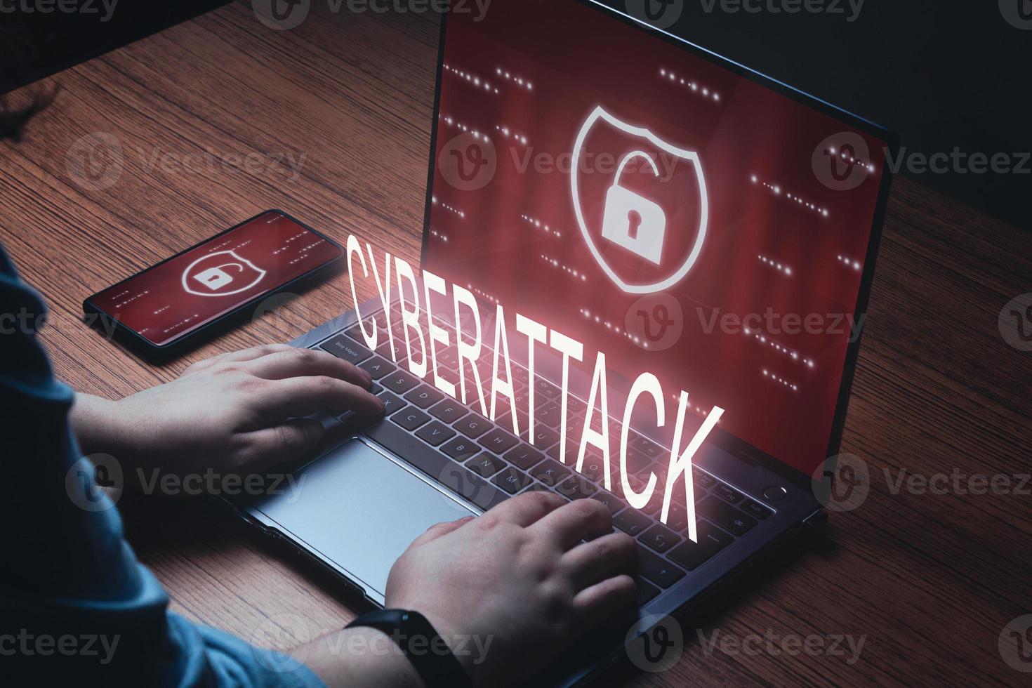 Woman use laptop with cyberattack warning on screen. Cyber security data protection business technology. Unlocked icon shield symbol. Protection against dangers. photo