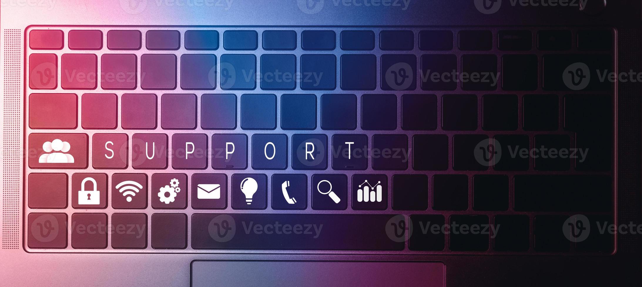 Top view of laptop keyboard with contact us or customer support hotline people connect. Feedback, business and finance concept. photo