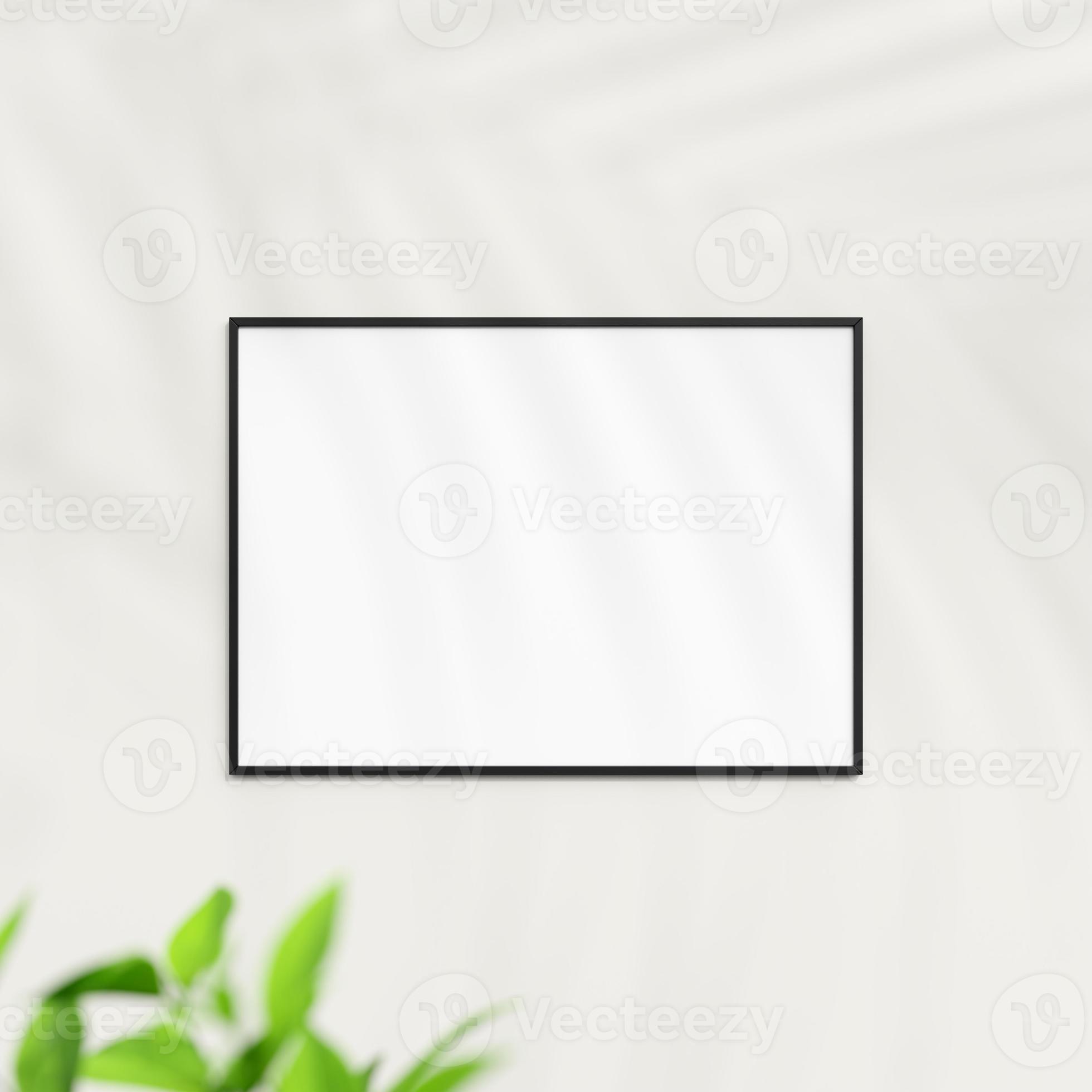 Photo frame mockup on white wall. Poster mockup. Clean, modern, minimal
